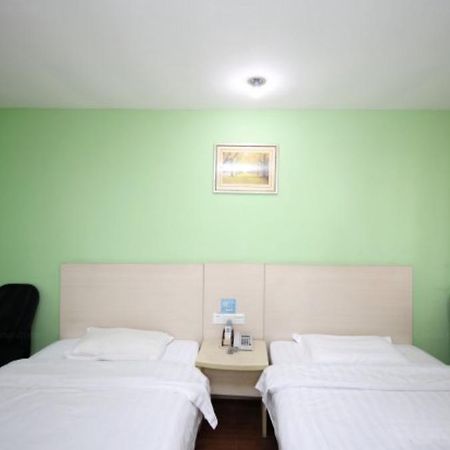 Yixin Business Hotel Cantão Exterior foto