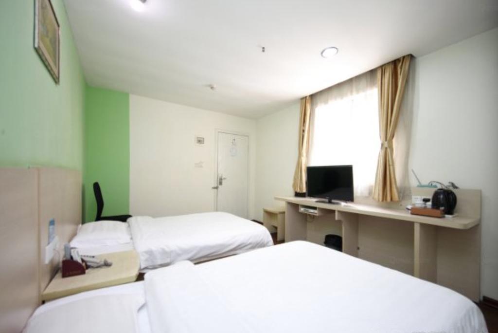 Yixin Business Hotel Cantão Exterior foto