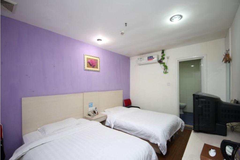 Yixin Business Hotel Cantão Exterior foto