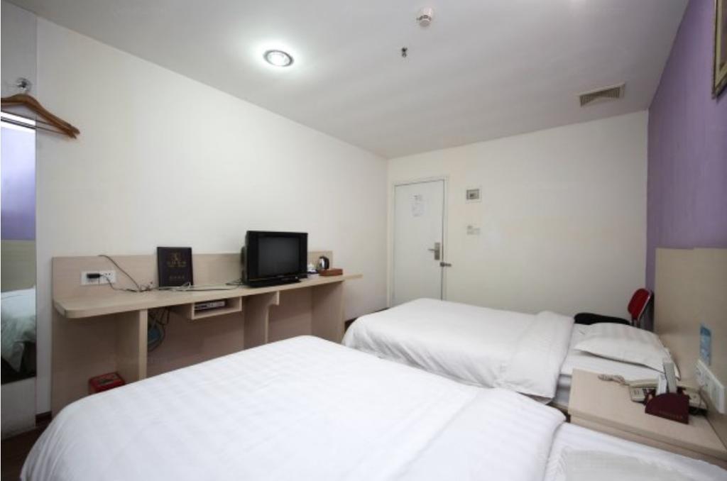 Yixin Business Hotel Cantão Exterior foto