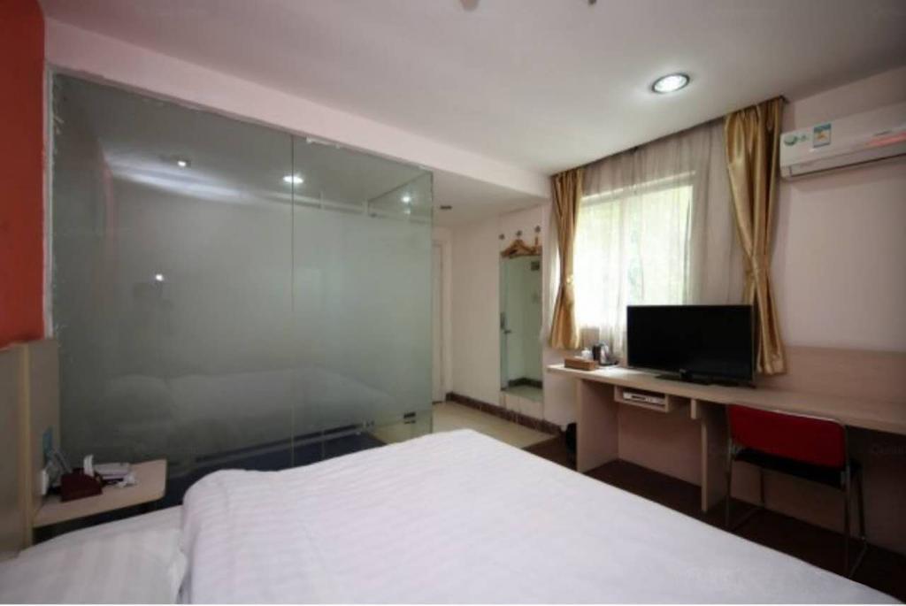 Yixin Business Hotel Cantão Exterior foto